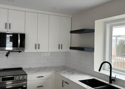 Small kitchen dark sink vert-Kamloops Kitchen Studio