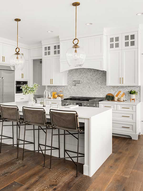 white kitchen in new luxury home, with waterfall island vert