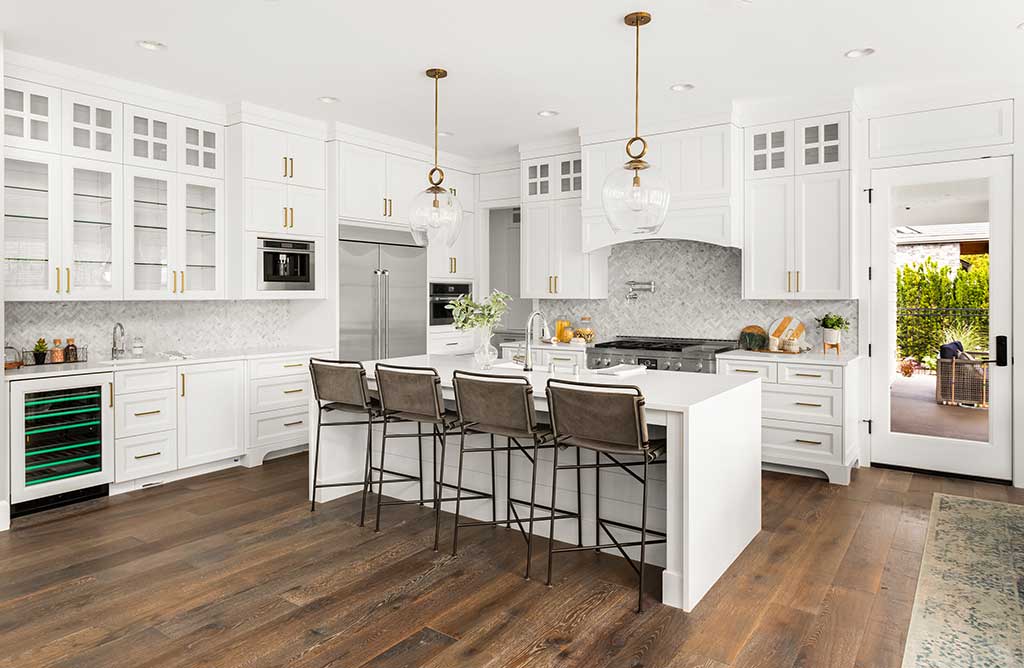 white kitchen in new luxury home, with waterfall island